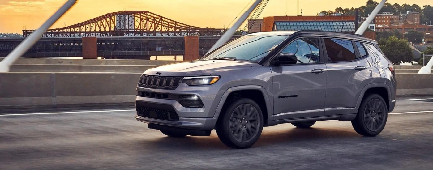 Silver 2022 Jeep Compass crossing a bridge