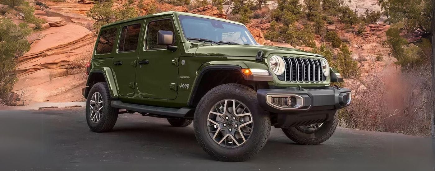 Green 2026 Jeep Wrangler Sahara Unlimited parked at an angle