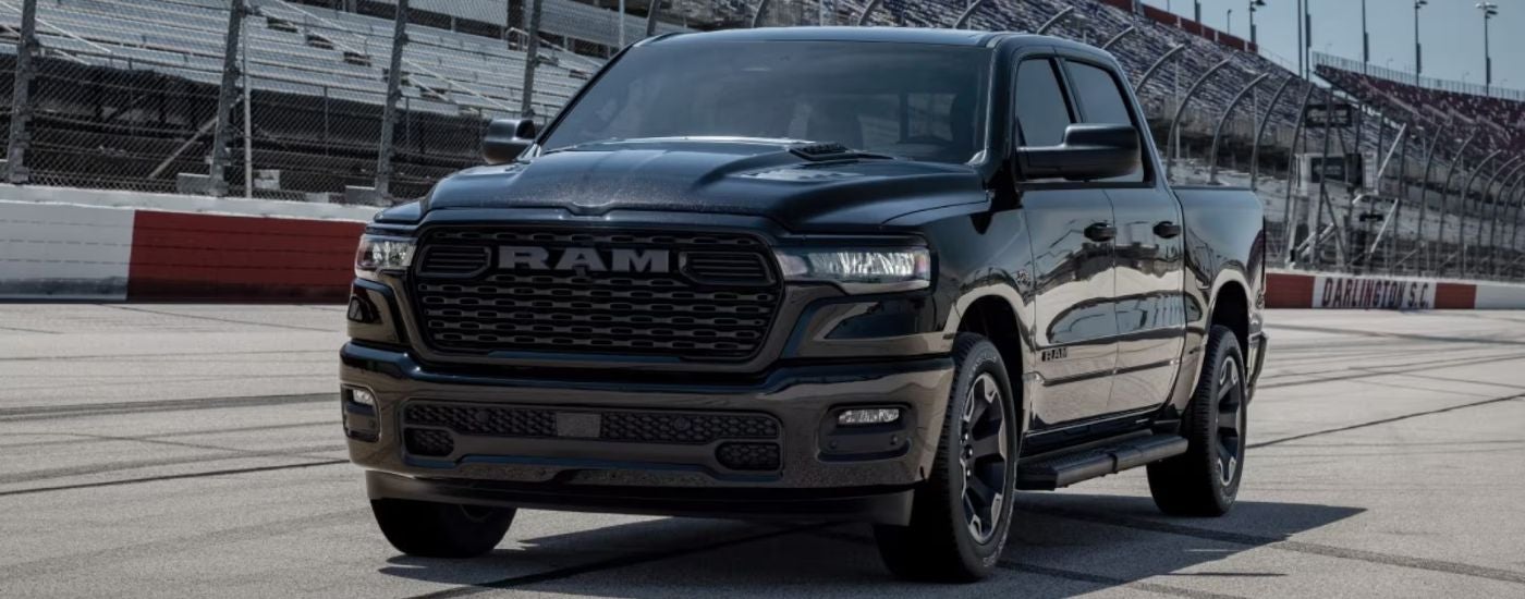 Black 2026 Ram 1500 Black Express on a race track.