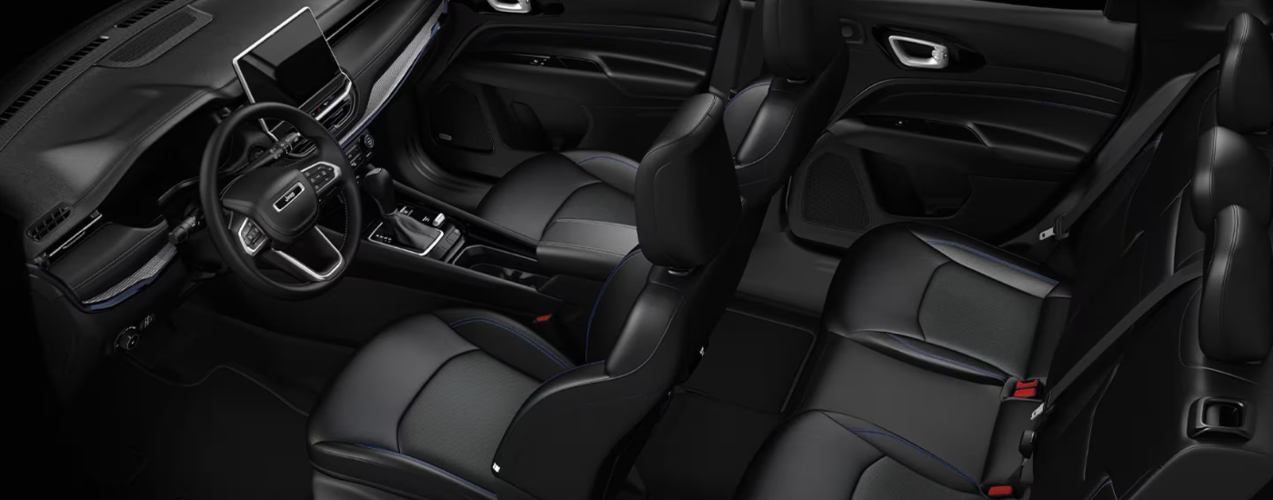 Black leather interior of a 2026 Jeep Compass