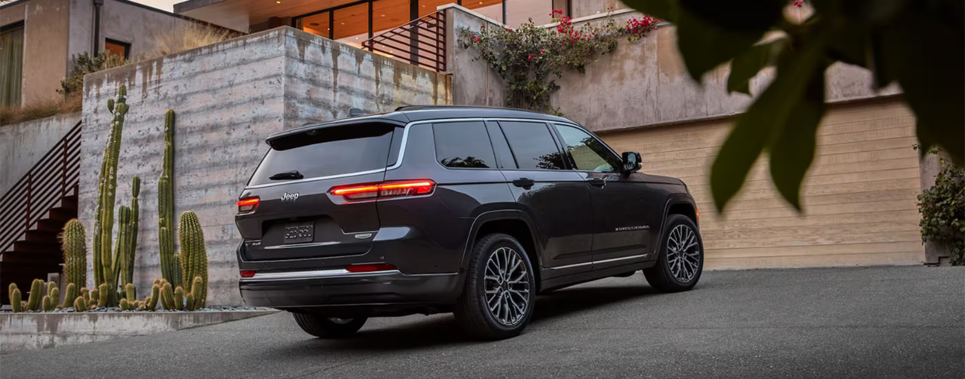 Black 2026 Jeep Grand Cherokee parked in a driveway