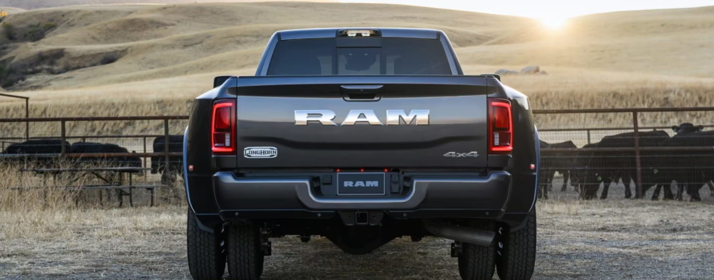 Chrome RAM logo on the tailgate of a grey 2026 Ram 3500